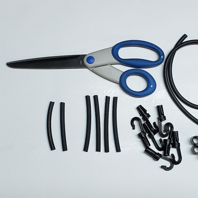 Cut support cord material with sharp scissors.