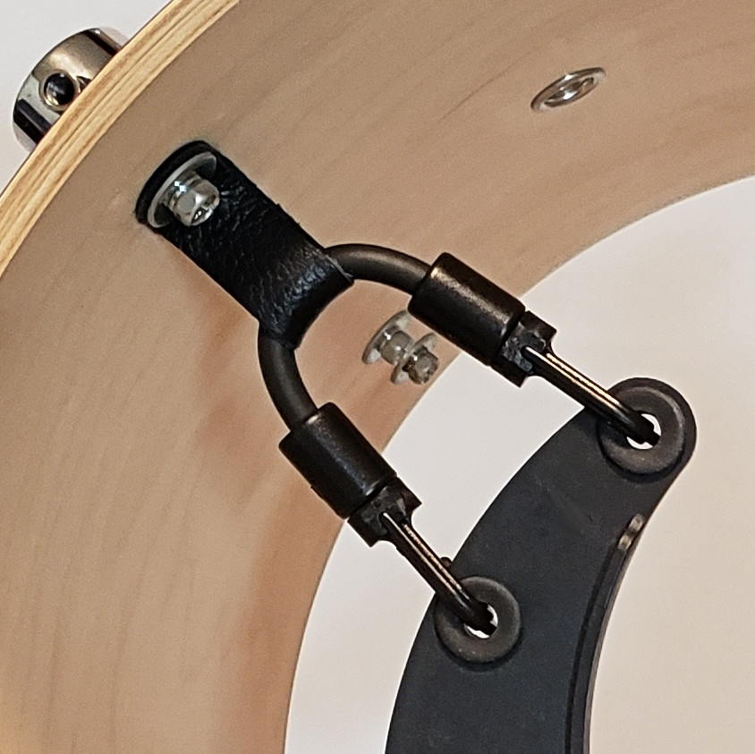 Kelly SHU support cord inside tom drum shells.